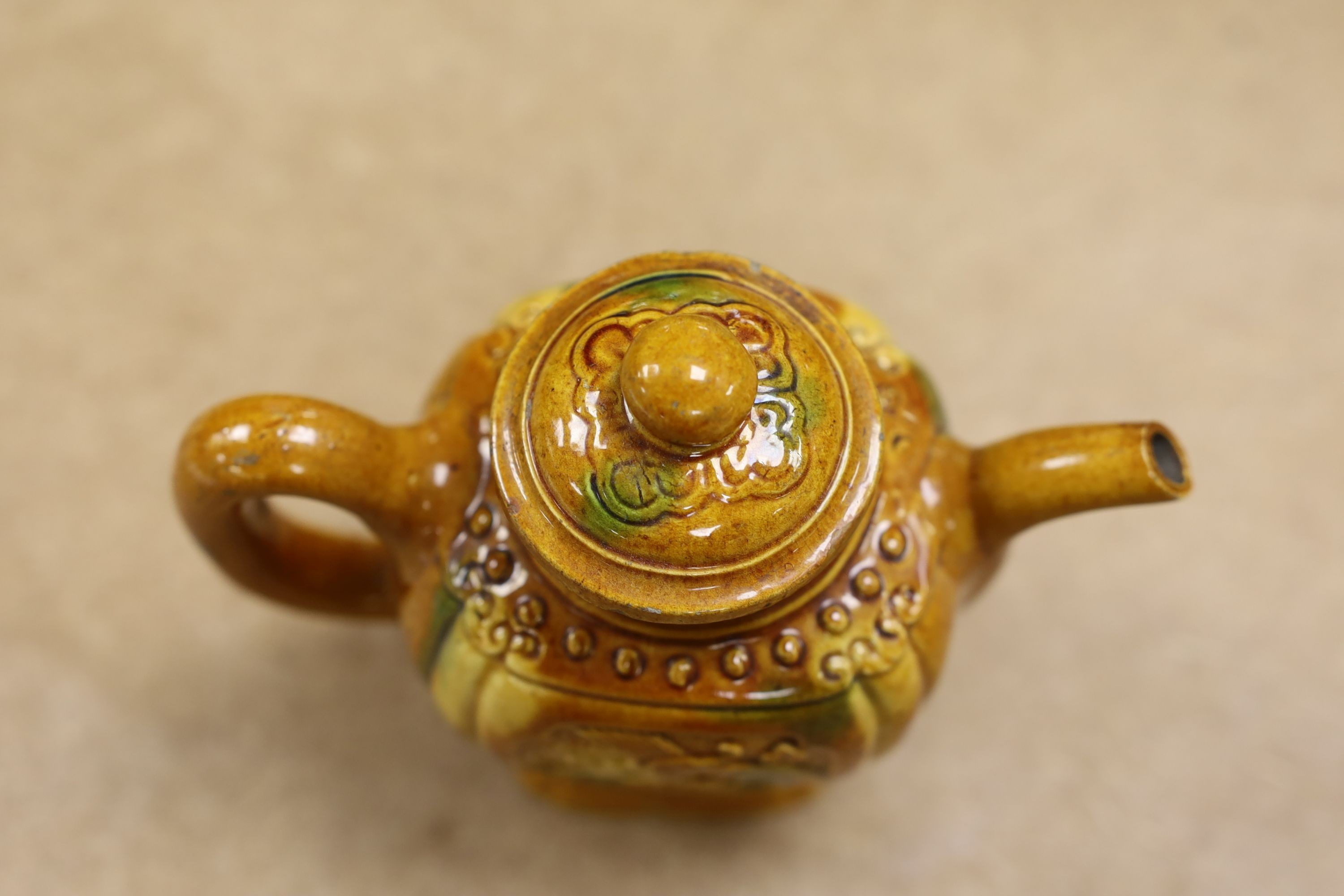 A Chinese enamelled yellow-ground jar and cover, a pottery teapot and cover and a flambe vase, latter 13cm